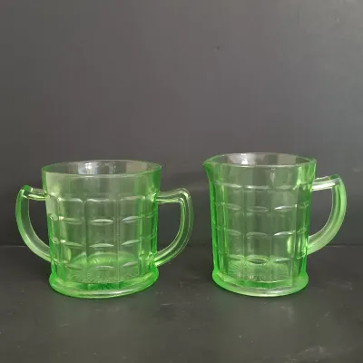 LOT 271: Uranium Glass Measuring Cup, Water Glass and Divided Dish with Block Style Creamer, Open Sugar Bowl and Plate