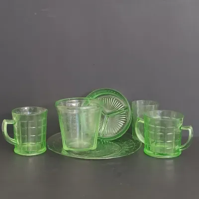 LOT 271: Uranium Glass Measuring Cup, Water Glass and Divided Dish with Block Style Creamer, Open Sugar Bowl and Plate