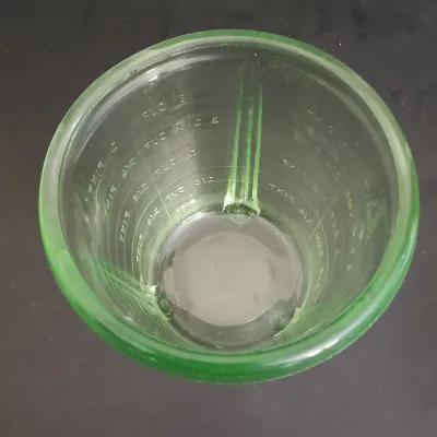 LOT 271: Uranium Glass Measuring Cup, Water Glass and Divided Dish with Block Style Creamer, Open Sugar Bowl and Plate