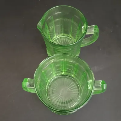 LOT 271: Uranium Glass Measuring Cup, Water Glass and Divided Dish with Block Style Creamer, Open Sugar Bowl and Plate