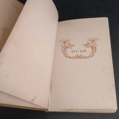 LOT 207: Collection of Antique Books: Li"l" Gal by Paul L Dunbar, The Castle & The Cottage by E. Perring, Songs of Sierra...