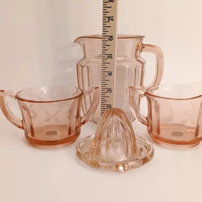 LOT 216: Collection of Pink Depression Glass - Pitcher, Juicer, Creamer and Sugar Bowl