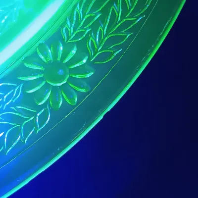 LOT 199: Uranium Glass Daisy Pattern Divided Plates