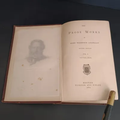 LOT 206: Leatherbound Bronte's Poems, Mini Leatherbound Christmas Carol, Longfellow's Prose Works 1866 and Whittier's...