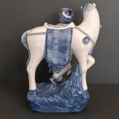 LOT 227: Bombay Blue and White Porcelain Figurine