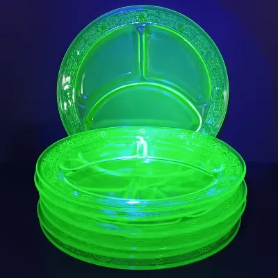 LOT 199: Uranium Glass Daisy Pattern Divided Plates