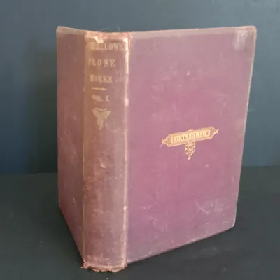 LOT 206: Leatherbound Bronte's Poems, Mini Leatherbound Christmas Carol, Longfellow's Prose Works 1866 and Whittier's...