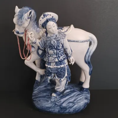 LOT 227: Bombay Blue and White Porcelain Figurine
