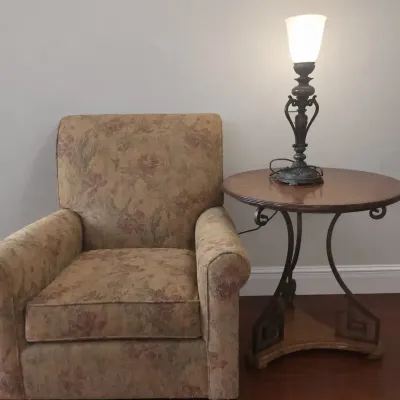 ARM CHAIR WITH ROUND SIDE TABLE AND LAMP