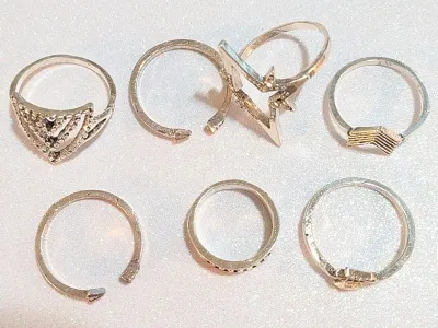 **NEW ARRIVAL** Sizes 3 to 8 Collection of 7 Silver Colored Rings in Assorted Styles and "Rough-Hewn Settings (8.9g)