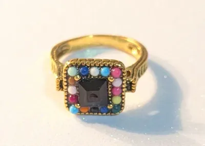 **NEW ARRIVAL** SIZE 10 RING Featuring a BLACK Tone Center Stone. Surrounded by Small Round MULTICOLOR Beads. Design Extends to the...