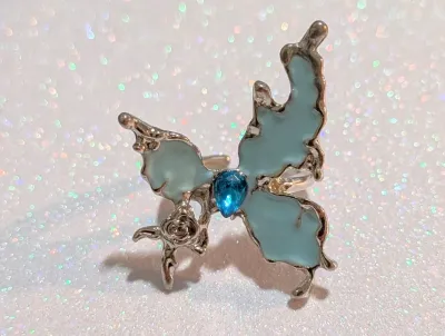 **NEW ARRIVAL** Size 6 Irregular Shape Enameled BLUE BUTTERFLY RING with Single Blue TEARDROP Stone Center on a Silver Tone Setting and...