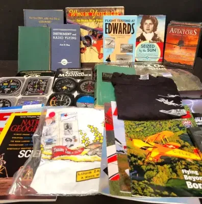 ASSORTED COLLECTION OF AVIATION THEMED BOOKS, AND RELATED MEMORABILIA 