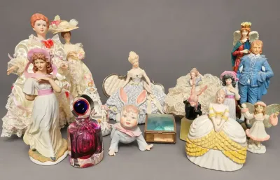 LADY'S COLLECTION OF FIGURINES
