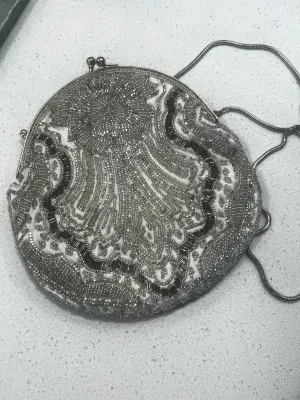 Vintage round evening bag featuring intricate silver and grey beadwork.