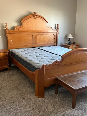 Ornate oak adjustable king-size bed frame.