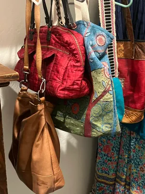 Collection of assorted handbags.
