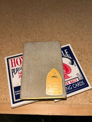 POKER CHIPS AND SEVERAL DECKS OF CARDS