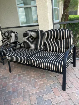 Patio Loveseat with Black Stripped Cushions