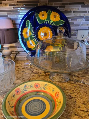 Mexican pottery sunflower dip and veggie/chip server in the background