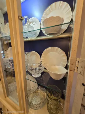 4 place settings of Pioneer Woman cream colored dishes.