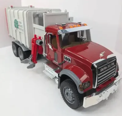 Red Bruder Mack Granite Side Loading Garbage Truck