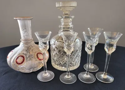 CUT-GLASS DECANTER WITH FIVE CANDLESTICK HOLDERS 