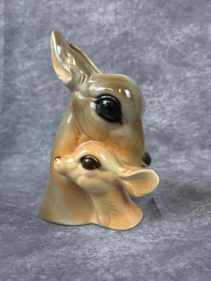 Mid-century ceramic deer bust planter featuring a doe and fawn with a glossy glaze finish.
