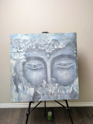 Contemporary mixed media canvas painting depicting a serene Buddha face in textured shades of blue, grey, and white, displayed on a black...