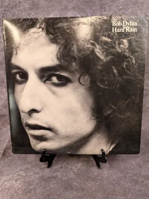 Bob Dylan "Hard Rain" vinyl live album, released in 1976. The jacket shows minor shelf wear around the edges.