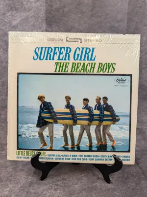 Vintage vinyl album copy of "Surfer Girl" by The Beach Boys, released by Capitol Records in 1963, shown sealed in shrink wrap...