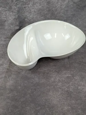 Modern white ceramic divided serving bowl with a glossy finish.