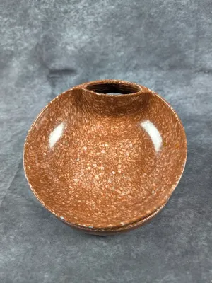 Vintage mid-century speckled terracotta-tone ceramic bowl featuring a unique contoured handle slot.