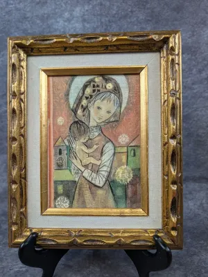 Mid-century modern framed print depicting a stylized Madonna and Child, housed in an ornate gilt wood frame with a linen liner.