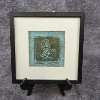 Framed relief print titled "Monkey" by artist Danny L., featuring a stylized monkey figure in shades of green and bronze,...