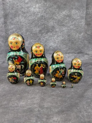 Ten-piece Russian nesting doll set featuring hand-painted fairy tale scenes, gold leaf details, and a glossy lacquer finish.