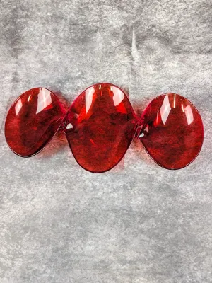 Mid-century modern ruby red glass three-part relish dish with a wavy, organic shape.