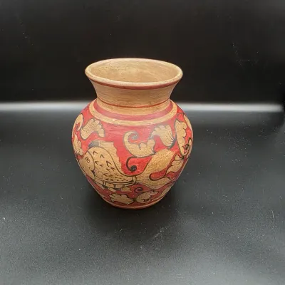 Hand-painted Tonala-style pottery vase featuring red slip and intricate fish motifs with a wide flared rim.