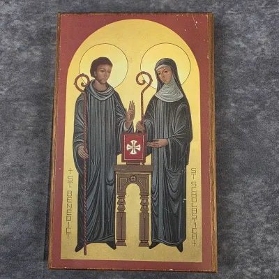 Religious wooden plaque depicting Saint Benedict and Saint Scholastica in a traditional Byzantine iconographic style.