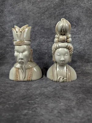 Pair of vintage mid-century ceramic Asian bust figurines with a glossy grey and brown glaze finish.