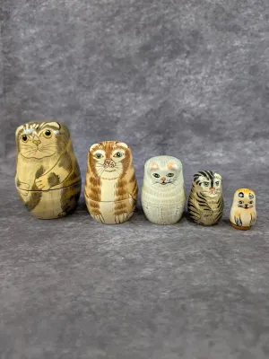 Five-piece set of hand-painted wooden nesting dolls depicting various cat breeds, including tabby and calico patterns.