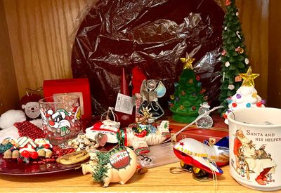 Assortment of vintage Christmas decorations, including a Sylvester the Cat glass, a Norman Rockwell "Santa and His Helper" mug,...