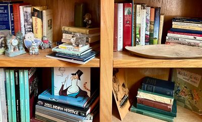 A collection of vintage and modern books, including art history, religious texts, and children's literature, displayed on oak...