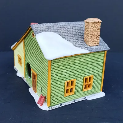 LOT 128: Department 56 Dickens Village Series The Old Curiosity Shop and Geo Weeton Watchmaker with New England Village Series Nathaniel...