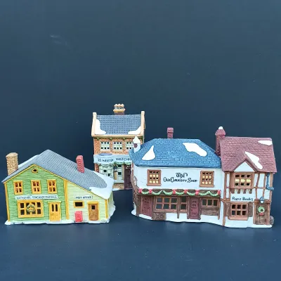 LOT 128: Department 56 Dickens Village Series The Old Curiosity Shop and Geo Weeton Watchmaker with New England Village Series Nathaniel...