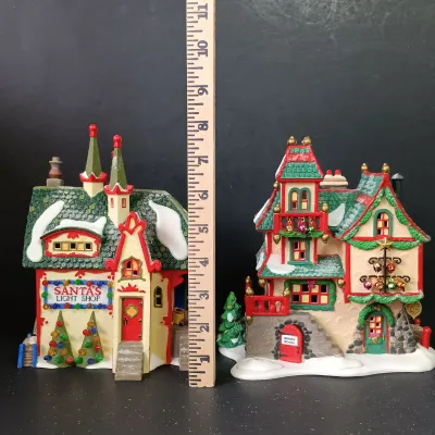 LOT 173: Department 56 North Pole Series Glass Ornament Works and Santa's Light Shop