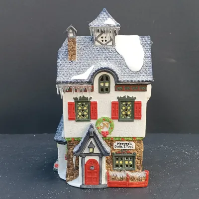 LOT 134: Department 56 North Pole Series Santa's Rooming House, Neenee's Dolls & Toys, and End of the Line