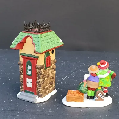 LOT 134: Department 56 North Pole Series Santa's Rooming House, Neenee's Dolls & Toys, and End of the Line