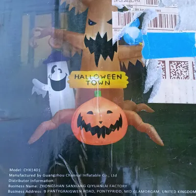 LOT 113: Inflatable 8ft Halloween Town Tree with Inflatable 6ft Ghost