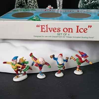 LOT 176: Department 56 Village Animated Skating Pond and North Pole Series Elves on Ice